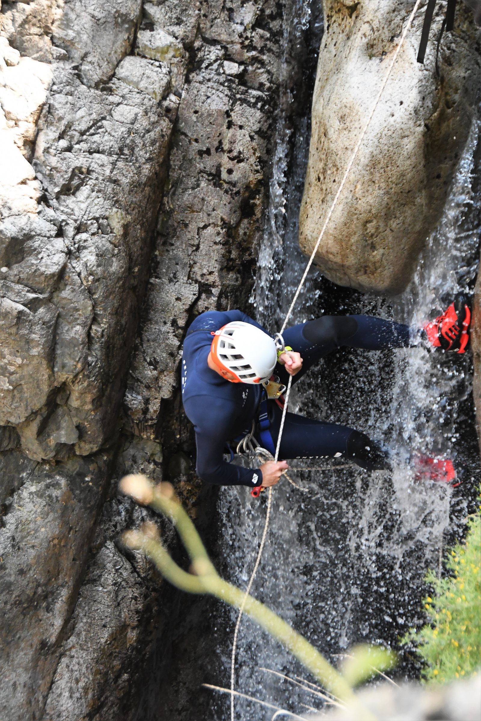 Person rappelling in the Richiusa Canyon