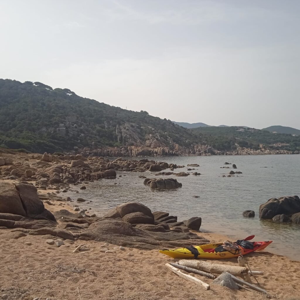 Kayaking on a beach on the island of Isula Piana during our guided trip to Mare e Sole