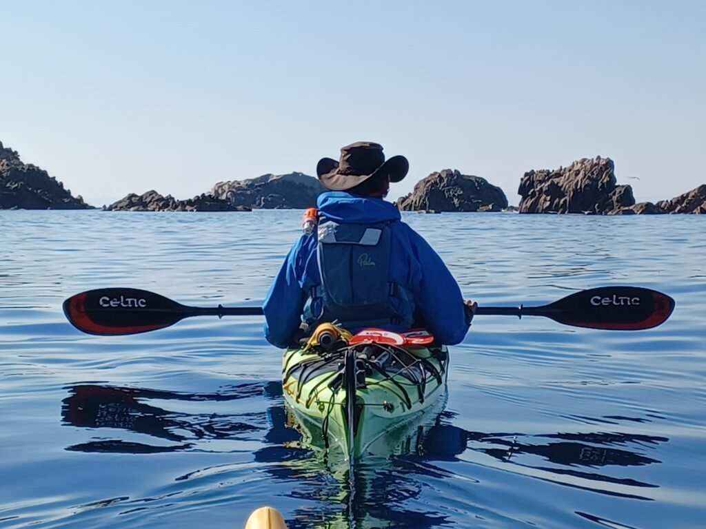 Pat enjoying the amazing corsican coast while sailing on the sea kayak