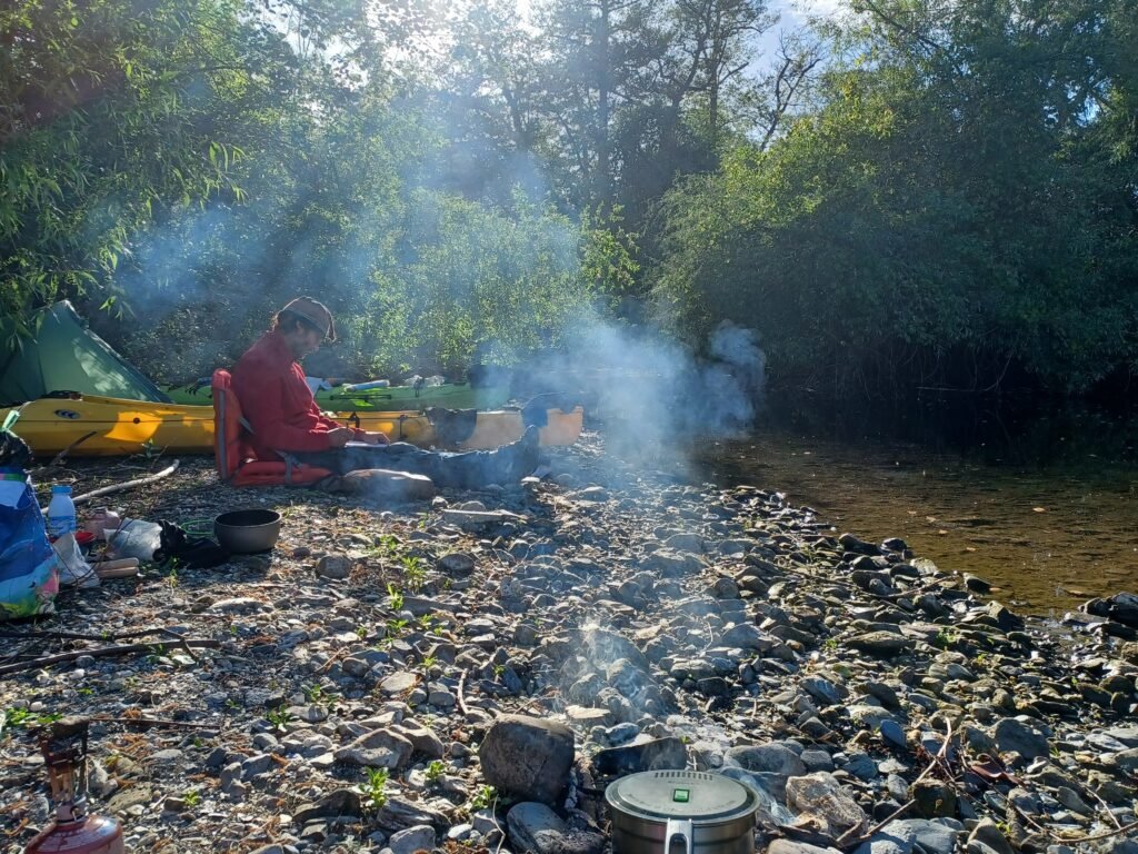 Pat resting and writing his journal on his night camp