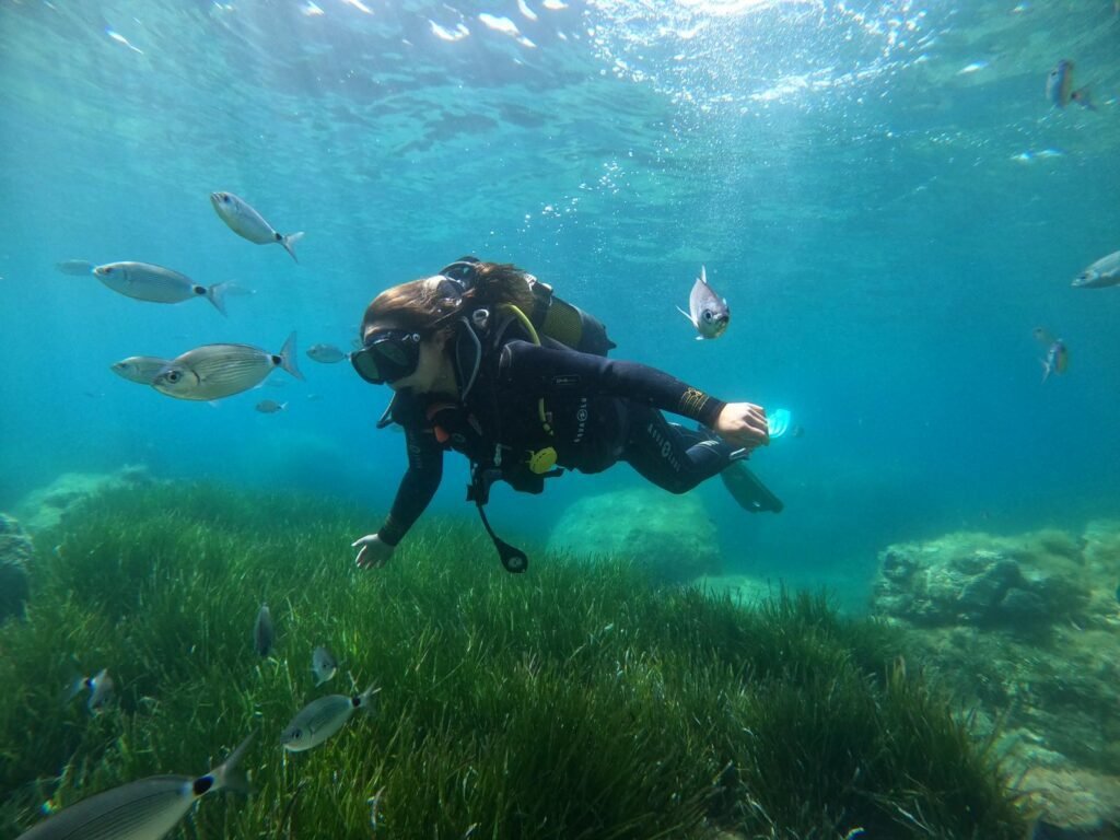 A woman who is scuba diving near Ajaccio