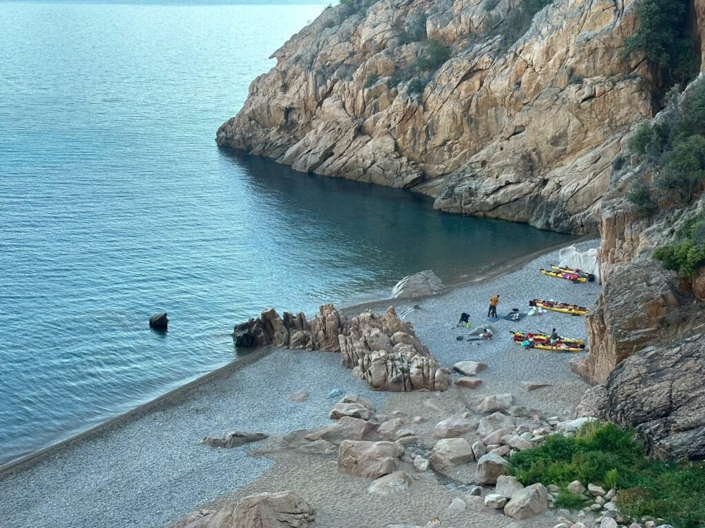 People sleeping on the beach in Corsica following the current regulations